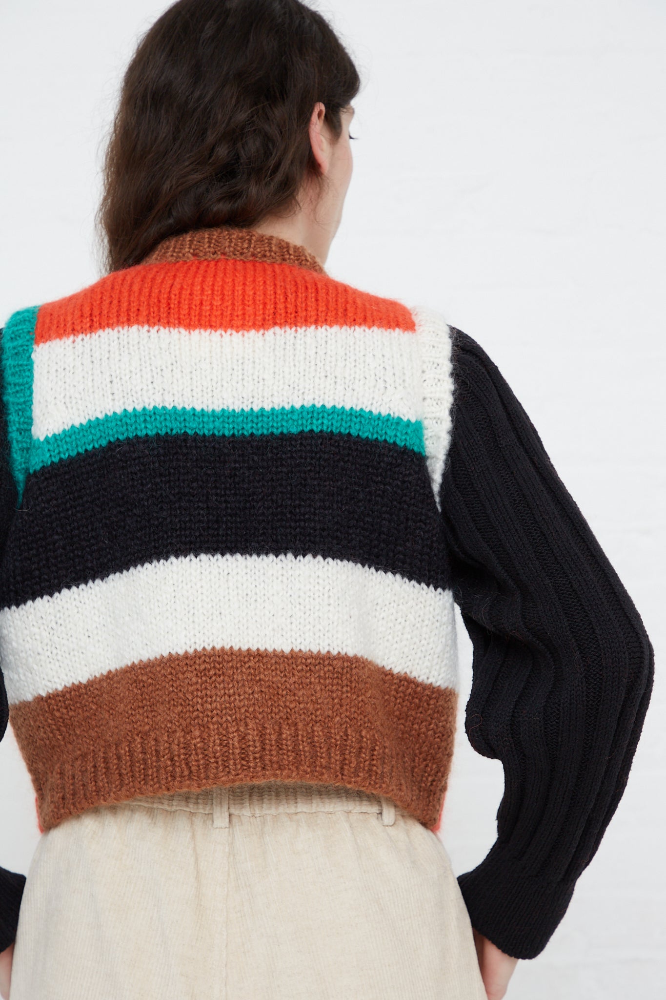 The back view of a woman wearing a Cordera Striped Mohair Waistcoat.
